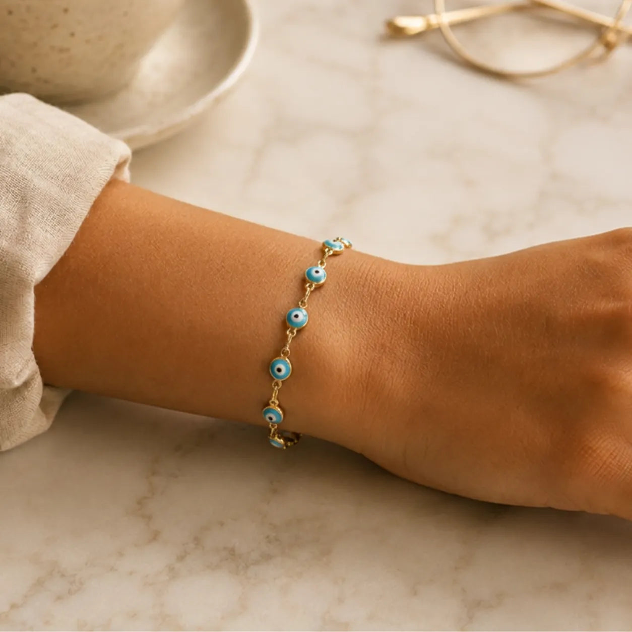 Pulseira Olho Grego Dourada Azul-Claro